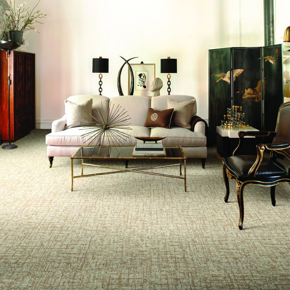 rug over beige carpet