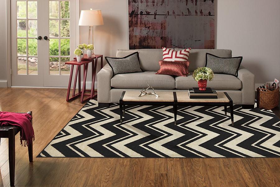 Area rugs bring the room together, add comfort, character  and style